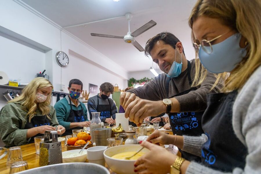 Athens: Food Market Visit and Cooking Class with Wine - Sitting down to eat what you made
