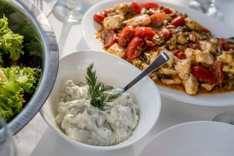 Athens: Half-Day Sunset Catamaran Cruise with Meal & Drinks - Swimming and snorkeling in the evening sea