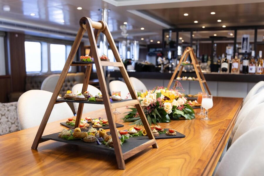 Athens: Saronic Islands Cruise with VIP Area Seating & Lunch - Entertainment on the return crossing