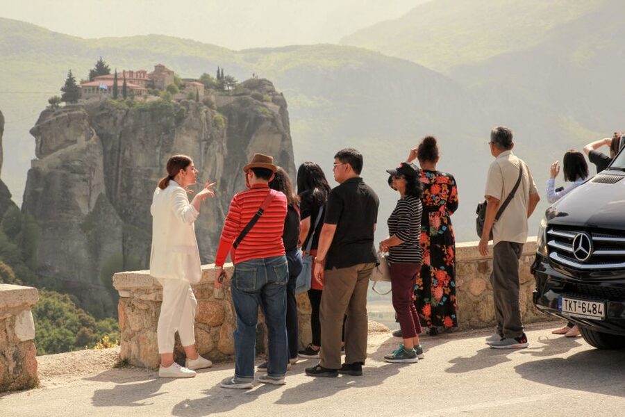 Athens to Meteora: Monasteries & Hidden Caves Bus Tour - Arriving at Kalambaka and meeting the local team