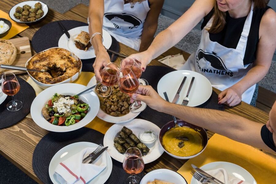Athens: Traditional Greek Cooking Class with Full Meal - Sitting down to the meal you helped prepare