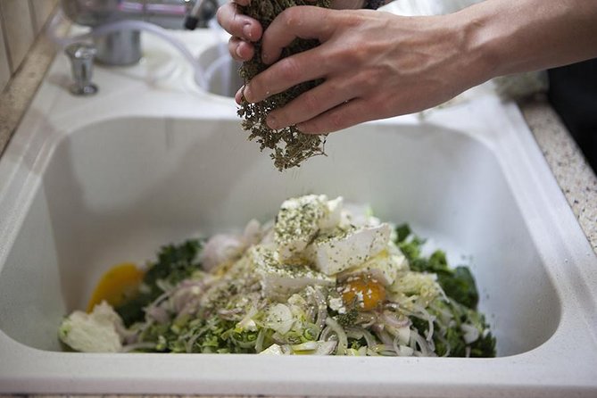 Cooking Class in Athens: Learn the Art of Phyllo with Christina - Rolling phyllo at the dining table