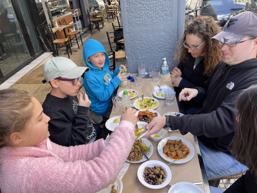 Delicious food tour for families 15+ iconic Greek foods - Varvakeios Market, Athens at work