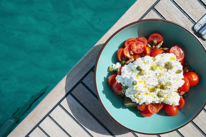Luxury Catamaran Sunset Private & Greek Gastronomy in Athens - Vouliagmeni Beach while lunch is prepared
